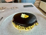 Dessert served at Lamadrid Estate Wines with a chocolate layer and pistachios in Mendoza, Argentina during an evening dining experience by Wendy Howard
