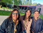 Friends enjoying time at Lamadrid Estate Wines in Mendoza Argentina during a sunny day with beautiful surroundings by Wendy Howard
