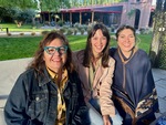 Friends enjoy a sunny day at Lamadrid Estate Wines in Mendoza, Argentina, sharing smiles and laughter outdoors near the vineyard by Wendy Howard