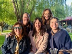 Group of friends enjoying a gathering in Lamadrid Estate Wines, Mendoza, Argentina on a sunny day by Wendy Howard