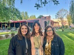 Visitors enjoy a sunny day at Lamadrid Estate Wines with friends in Mendoza, Argentina near vineyards and gardens by Wendy Howard