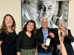 Group celebrates wine tasting at Bodega Carmelo Patti in Mendoza Argentina with smiles and bottles by Wendy Howard