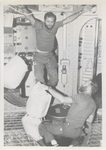 Skylab 4 Crew Using Orbital Workshop Trash Airlock