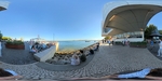 Visitors relax along the waterfront in Lisbon while enjoying views of the river and city architecture during a sunny day by Wendy Howard
