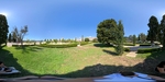 Exploring the green space and pathways in a Lisbon park under a blue sky by Wendy Howard