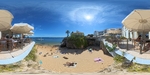 Scenic view of a beachside restaurant in Lisboa with sunbathers and umbrellas by Wendy Howard