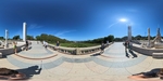 Visitors enjoy a sunny day at Eduardo VII Park in Lisboa, taking in the views and vibrant greenery around them by Wendy Howard