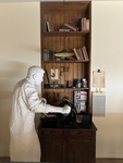 Exhibit of a figure working at an antique typewriter in Museu do Aljube in Lisbon by Wendy Howard