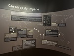 C√°rceres do Imp√©rio display at Museu do Aljube showcasing historical prison locations in Portugal's former empire by Wendy Howard