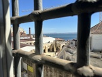 View of Lisbon from Museu do Aljube with a glimpse of the river and buildings by Wendy Howard