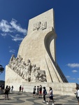 Monument to the Discoveries in Lisbon with visitors exploring the historic site by Wendy Howard