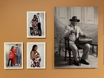 Families and portraits displayed on a gallery wall in Lisbon showcasing diverse moments and heritage by Wendy Howard