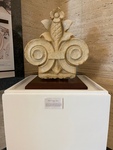 Elegant Stone Sculpture Showcases Intricate Design at an Art Exhibit in a Modern Gallery 1 by Maria Grisales