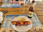 Savory Barbecue Skewer With Side Dishes and a Refreshing Drink at Restaurant Hipi Cache 1 by Wendy Howard