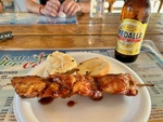 Savory Barbecue Skewer With Side Dishes and a Refreshing Drink at Restaurant Hipi Cache 2 by Wendy Howard