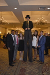 Stilt walker and guests at Cocktail Hour 1 by Rosen College of Hospitality Management