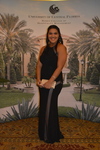Guest at step and repeat 13A by Rosen College of Hospitality Management