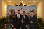 Stilt walker, guests at step and repeat A by Rosen College of Hospitality Management