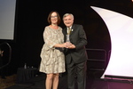 Kathie Canning receives award from Dr. Pizam 1 by Rosen College of Hospitality Management