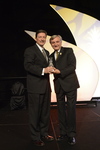 Bill Davis receives award from Dr. Pizam 2 by Rosen College of Hospitality Management