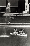 Reflecting pond, students in canoe