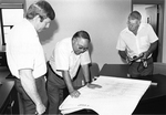 Engineering & Business Administration Building - men checking schematics