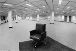 Library renovation - lone chair seen through wide angle lens